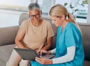Older adult and family member reviewing care options with a senior living advisor at a table.
